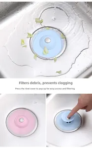 Kitchen sink silicone drain plug detail showing pop-up mechanism and debris filtering