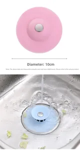 Detailed view of 10cm silicone sink stopper with push-button filter in pink and blue