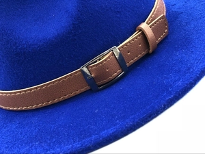 Classic blue wool felt fedora hat featuring brown leather band with metal buckle detail