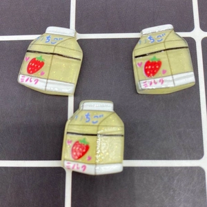 Macro view of strawberry milk carton resin charm for DIY phone case and crafts