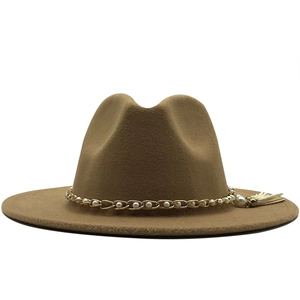 Detail of khaki wool fedora hat featuring golden chain, white pearls and side tassel