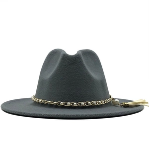 Detailed shot of dark grey wool fedora featuring pearl chain and tassel decoration