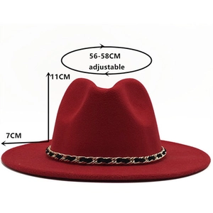 Detail view of red wide brim fedora with size specs and black-gold chain trim