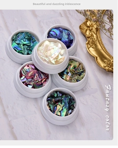 Macro detail of iridescent colorful shell fragments for 3D nail art decoration set