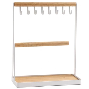 Minimalist white metal jewelry stand with wooden base for keys and necklace storage
