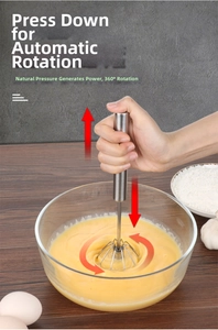 Action shot of hand-pressed stainless steel semi-automatic whisk mixing eggs in a glass bowl