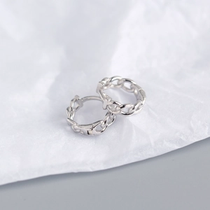 Macro shot of silver S925 sterling silver chain link hoop earrings with high polish finish