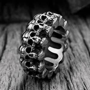 Detailed close-up of a men's punk skull ring with embossed vintage steel patterns