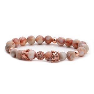 Rose gold beaded bracelet featuring crown charms and natural orange-brown stone beads