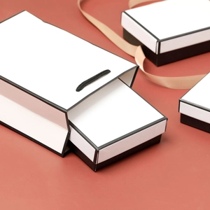 Minimalist white gift boxes and matching carry bags on a red background with ribbons