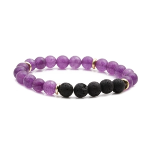 Amethyst and black lava stone beaded bracelet with golden spacers on a white background