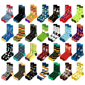 Flat lay of mid-calf socks featuring 28 diverse patterns including food and geometry