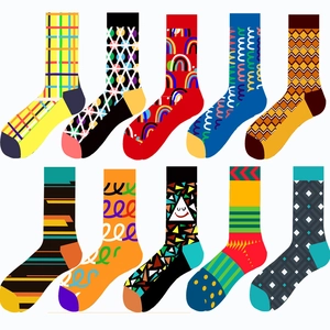Multiple colorful crew socks featuring geometric patterns, rainbows, and modern motifs
