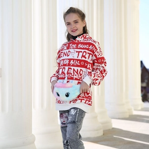 Detail of colorful unicorn plush waist bag for girls paired with streetwear hoodie