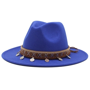 Detail of royal blue fedora hat with ethnic jacquard band and vintage metal coins