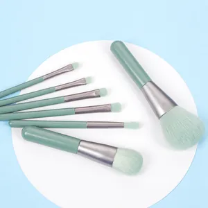 Detail of 7-piece mint green portable makeup brush set with fine fiber bristles