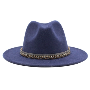 Detailed view of dark blue wool fedora hat featuring rhinestone woven decorative band