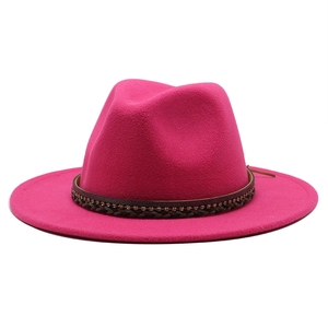 Detail of fuchsia wool fedora hat featuring an intricate rhinestone woven band
