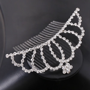 Macro detail of silver crown hair comb with sparkling rhinestones and metal finish