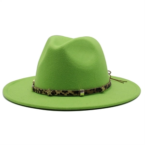 Detail of neon green wool fedora hat featuring leopard print band and gold star rivets