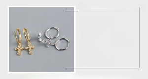 Detail view of S925 sterling silver mini cross hoop earrings with sparkling cubic zirconia