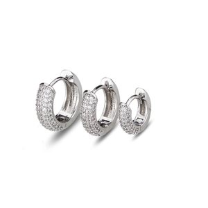 Three sizes of silver zircon-studded hoop earrings arranged on a white background
