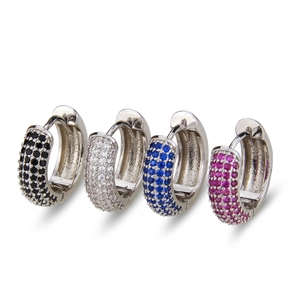 Macro detail of colorful zirconia huggie earrings in black, blue, pink and clear stones
