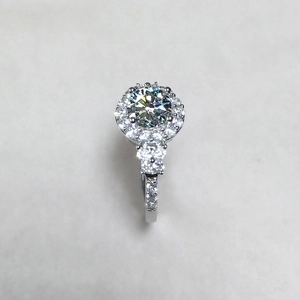 Luxury 2 carat round moissanite ring with halo setting and silver-tone diamond band
