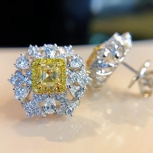 Luxury Asscher cut canary yellow diamond halo stud earrings in polished white gold