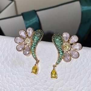 Elegant floral drop earrings with white petals and yellow water drop gemstone pendants