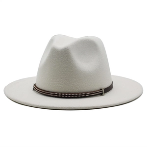 Close-up of white wool fedora hat featuring a brown leather band and metallic zipper detail