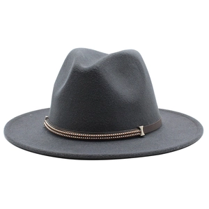 Detail of grey wool felt fedora featuring a brown leather band and metallic bead trim