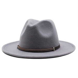 Detail of grey wool felt fedora hat featuring a brown leather band with silver bead accents
