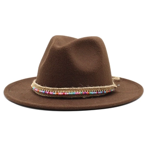 Detail of dark brown fedora featuring bohemian braided rope with colorful beads and sequins
