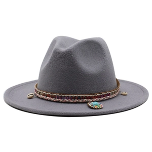 Close-up of grey fedora with ethnic woven band featuring natural shells and turquoise bead