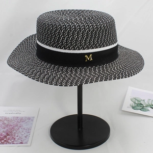 Elegant wide brim boater straw hat with black ribbon and gold M letter metal charm