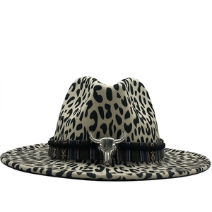 Detail of leopard print fedora with ethnic woven band and silver bull head ornament