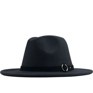 Detail of wool fedora hat with flat brim featuring a black ribbon and gold metal buckle