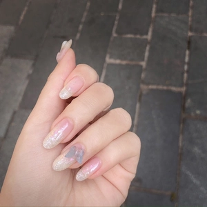 Glitter pink almond press-on nails with 3D blue butterfly and silver gradient finish