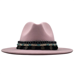 Detail of pink wool fedora with bohemian woven band, turquoise beads and metal charms