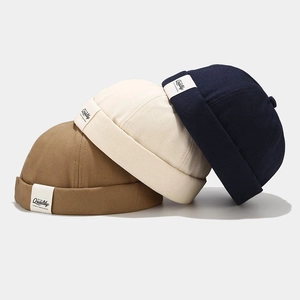 Three retro cotton miki hats in khaki, cream and navy blue with quality label