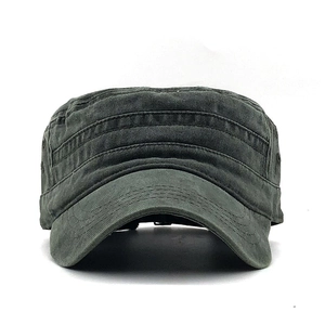 Detailed close-up of washed cotton canvas fabric and stitching on a flat top cadet army cap
