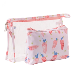 Detail of transparent PVC makeup bags featuring cute carrot patterns and pink zippers