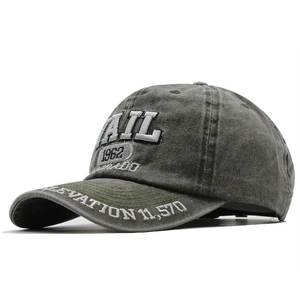 Vintage washed dark grey baseball cap with 1962 embroidery from a 45-degree angle