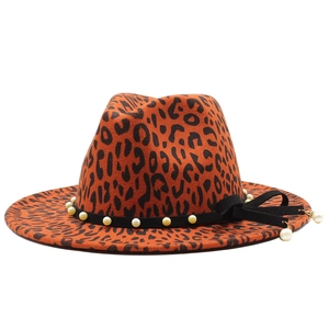 Orange leopard print fedora hat with pearl beaded band and black bow accessory