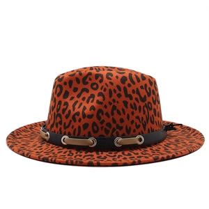 Detailed view of leopard print fedora hat featuring a leather band and metal eyelets