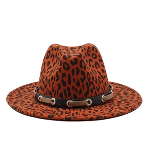 Detail of leopard print jazz fedora with black decorative belt and silver eyelets