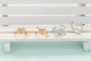 Sparkling heart-shaped Cupid arrow ear cuffs with cubic zirconia in gold and silver