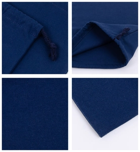 Detailed views of dark blue drawstring cotton bag showing fabric texture and cord closure
