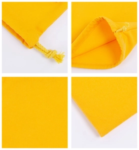 Macro detail of yellow canvas drawstring bag showing fabric texture and drawcord closure